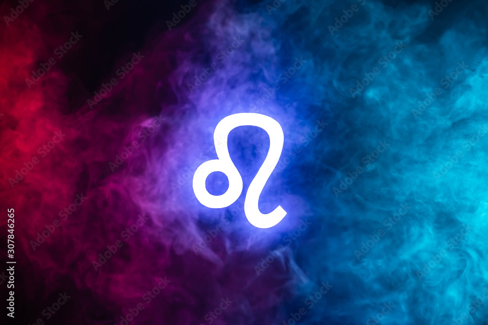 blue illuminated Leo zodiac sign with colorful smoke on background blue illuminated Leo zodiac sign with colorful smoke on background