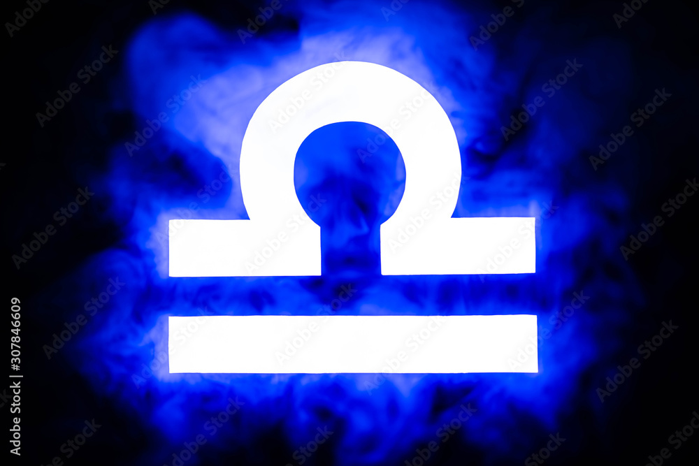 blue illuminated Libra zodiac sign with smoke on background blue illuminated Libra zodiac sign with smoke on background