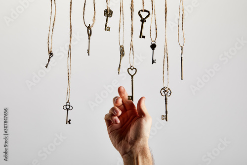 top view of vintage rusty keys on white background