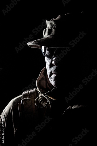 Elderly commando fighter studio portrait on black