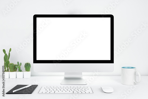 Computer with blank white copy space for text, Mockup design desktop computer in office on white table with keyboard and Coffee cub, Work place concept, Cactus in pot.