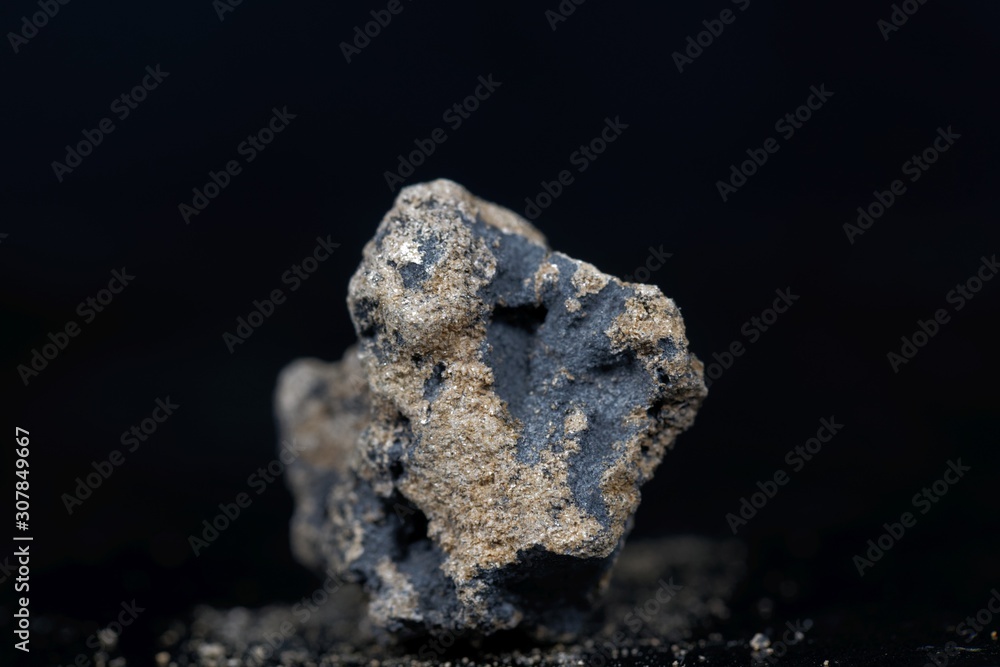 Fototapeta premium Calcium carbide or calcium acetylide with a black background