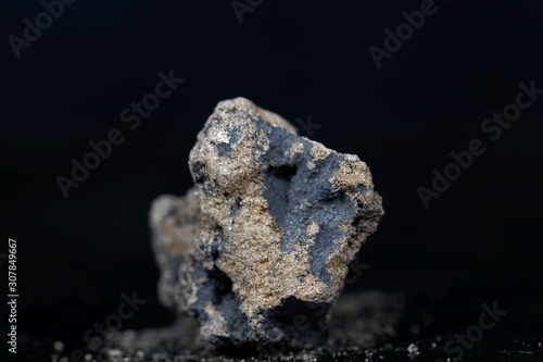 Calcium carbide or calcium acetylide with a black background