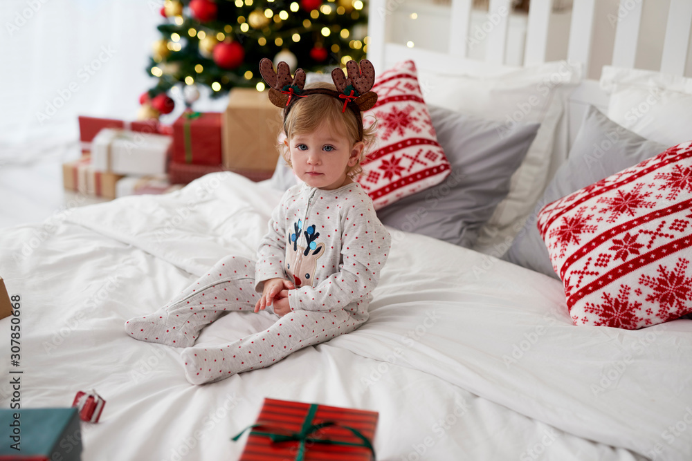 Portrait of charming baby in Christmas morning Portrait of charming baby in Christmas morning