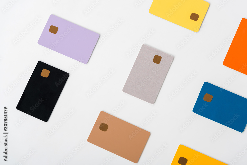 top view of multicolored credit card templates isolated on white top view of multicolored credit card templates isolated on white