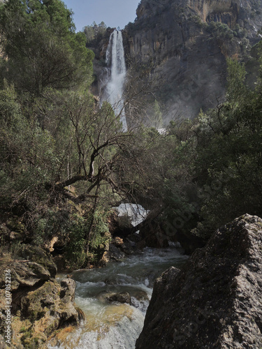 The waterfall of La Osera with its 130 meters is the highest in Andalusia. It is located on the Aguascebas Chico River, within the Natural Park of the Sierra de Cazorla, Segura and Las Villas, Jaén. photo