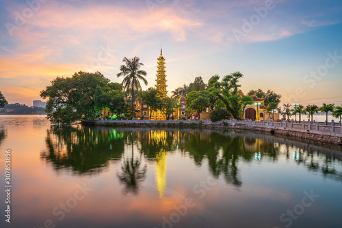 Panorama scene of Tran Quoc pagoda, the oldest temple in Hanoi, Vietnam, with brilliant sunset photo