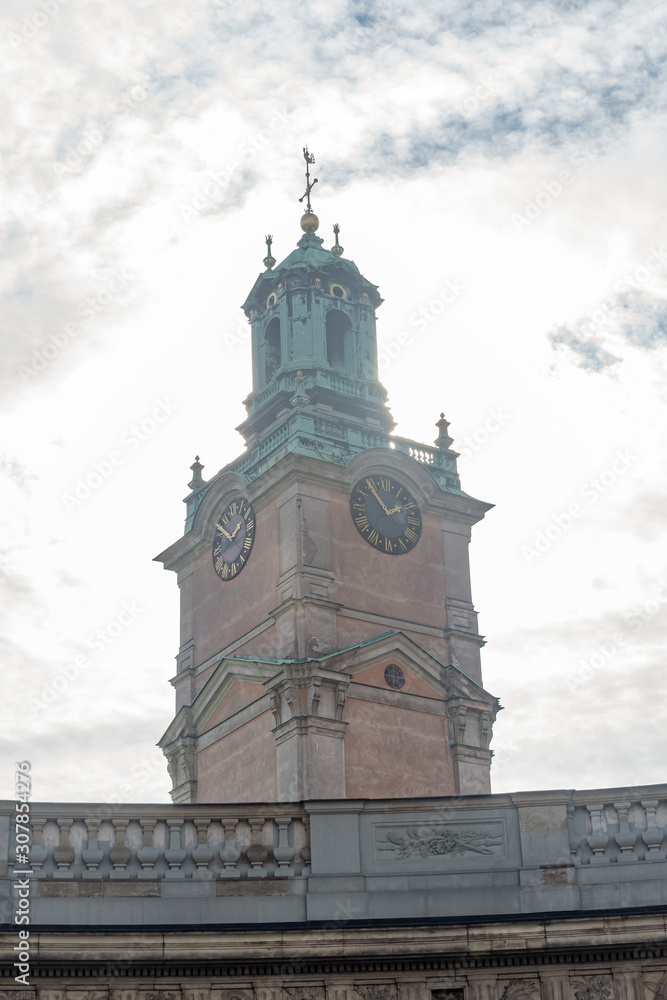 Tower of Storkyrkan, Cathedral Church of Saint Nicholas with sunny background in Stockholm, Sweden.