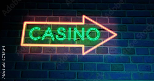 Neon Casino sign with glowing text in Las Vegas or Nevada. Club den for entertainment or gambling Hall - 4k