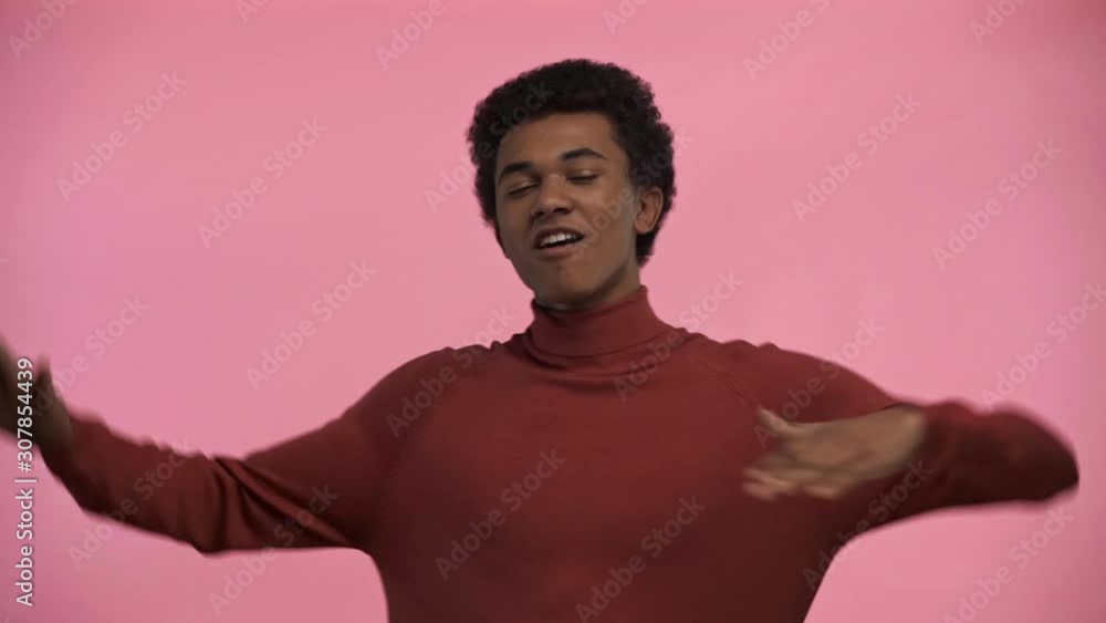 african american teenager dancing isolated on pink african american teenager dancing isolated on pink