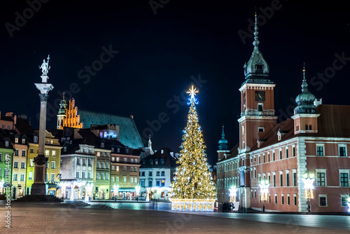 Warsaw city night panorama of old town at Christmas. Travelling. New Year. Christmas holidays. Illuminated christmas tree in old town in Warsaw Poland.