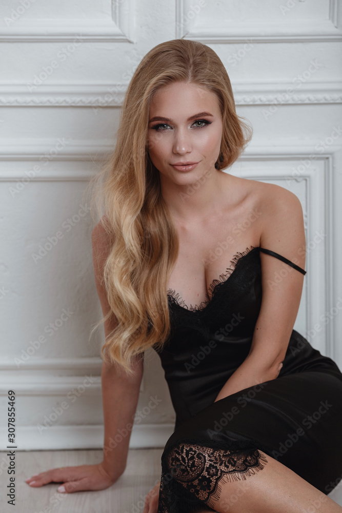 Cute blonde woman in gorgeous black dress Cute blonde woman in gorgeous black dress