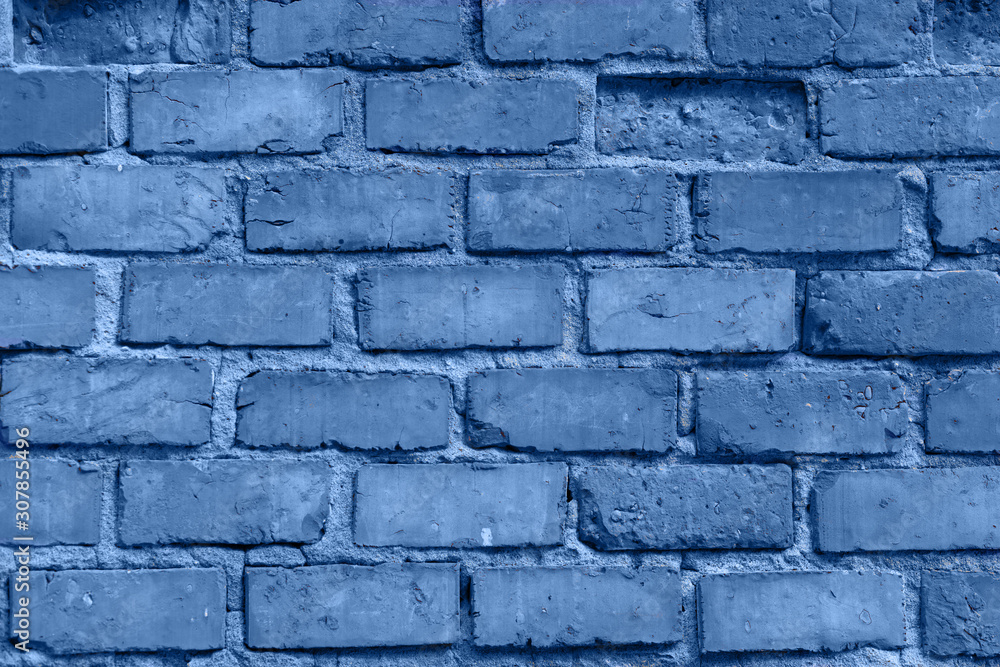 Old red brick wall in Italy. Faded red color, a bit dirty. Copy space for text. Toned in modern blue color 2020 Old red brick wall in Italy. Faded red color, a bit dirty. Copy space for text. Toned in modern blue color 2020
