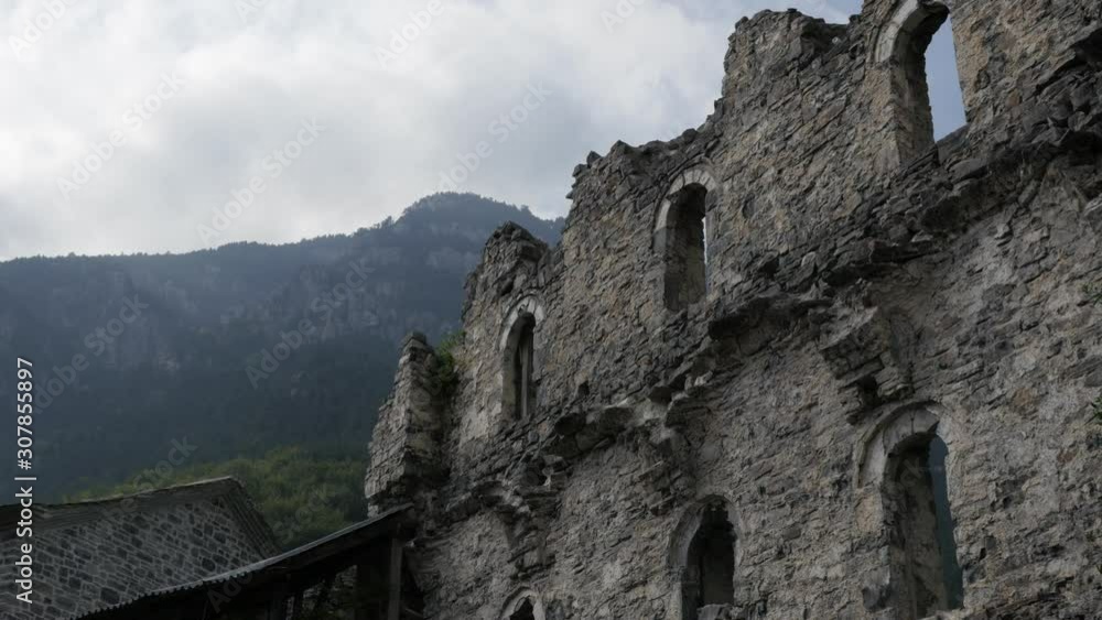 Protecting walls of Agios Dionysios monastery bombed during WW2 slow pan 4K footage Protecting walls of Agios Dionysios monastery bombed during WW2 slow pan 4K footage