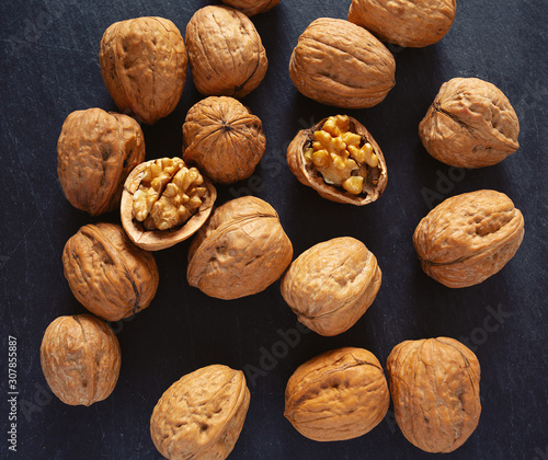 walnuts on black stone surface