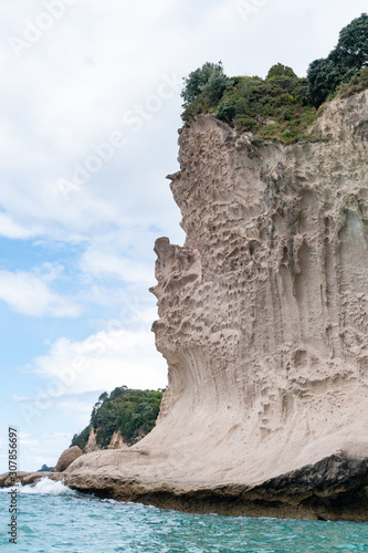 View of cliffs and ocean from Te Whanganui-A-Hei Cathedral Cove Marine Reserve in Coromandel Peninsula, New Zealand