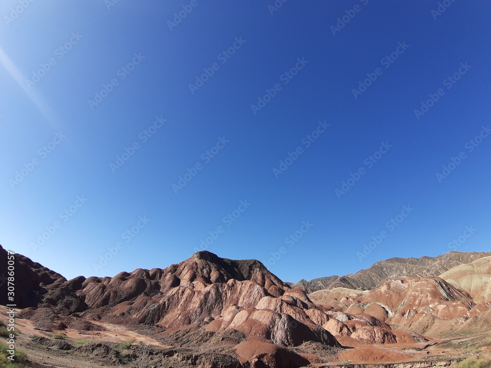 Clear blue sky and colorful mountain in the sunny day in summer use as background and nature concept.