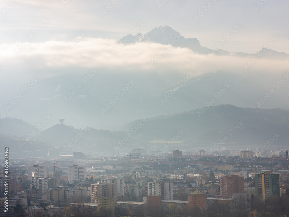 View over the city of Innsbruck, Austria on a hazy winter afternoon
