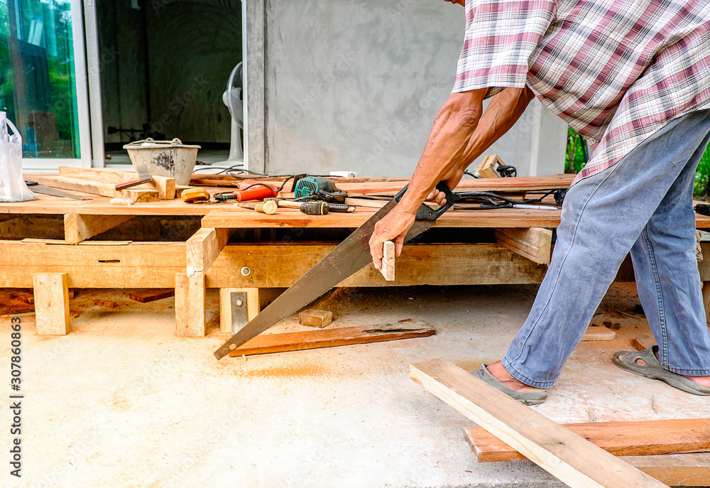 Carpenter cutting wood