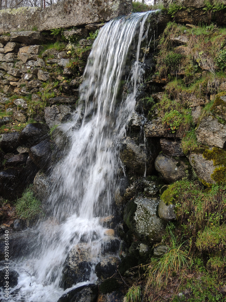 A small waterfall near Bohoyo in the Sierra de Gredos. Province of Ávila. Castile and Leon Spain A small waterfall near Bohoyo in the Sierra de Gredos. Province of Ávila. Castile and Leon Spain
