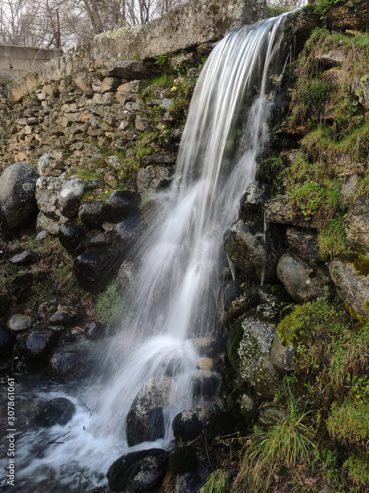 Fototapeta premium A small waterfall near Bohoyo in the Sierra de Gredos. Province of Ávila. Castile and Leon Spain