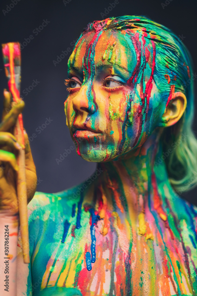 Fotobehang Body Paint Young woman covered with a colourful paint #307862264