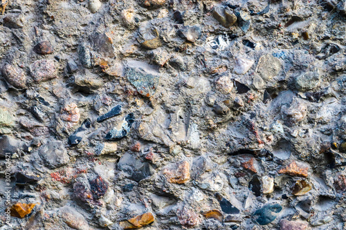 Detailed close up view on aged concrete walls with cracks and lots of strcuture photo