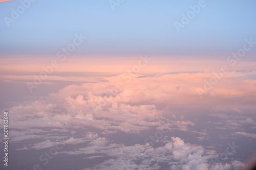 The sky in the evening light reflection on the cloud turning from white to pinkgold use as nature and background copyspace.