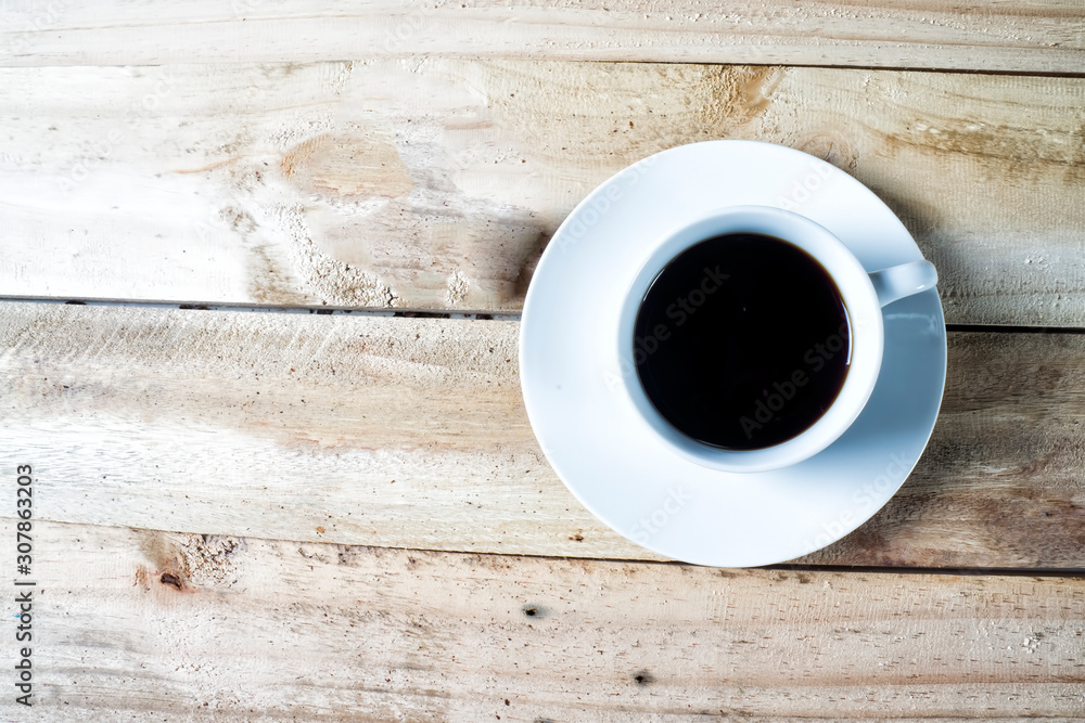 Top view of Coffee cup and saucer on a wooden table Top view of Coffee cup and saucer on a wooden table