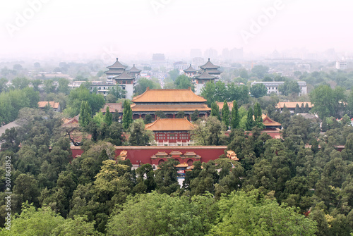 View of Beijing from the hill of Jingshan Park. At the northern foot of the hill is the Hall of Imperial Longevity. Cityscape in the smog