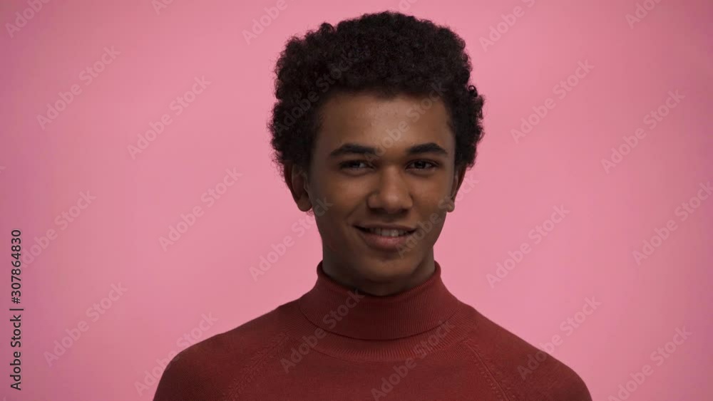 african american teenager blowing kiss isolated on pink african american teenager blowing kiss isolated on pink
