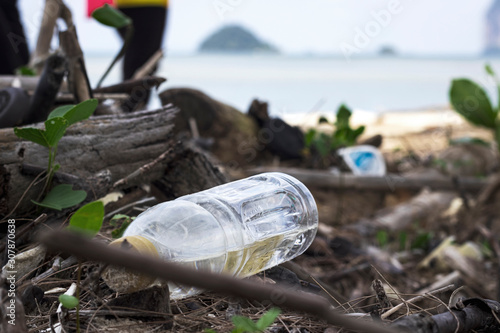 Empty used dirty plastic bottles on the seaside.