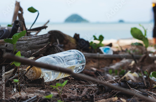Empty used dirty plastic bottles on the seaside.