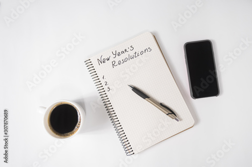 Canvas Print Phrase New Year's Resolutions in the notebook and pen