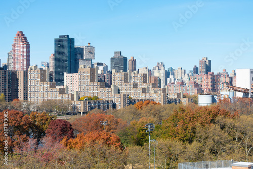 The Upper East Side Skyline with Colorful Autumn Trees along the East River in Long Island City New York