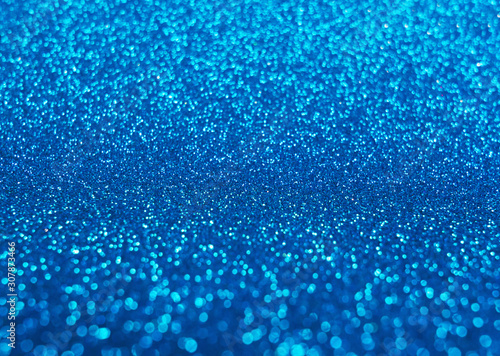 Blurred shining closeup of blue bright art texture. Macro design of classic glittering backdrop, soft selective focus. Color concept.