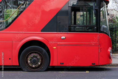 Canvas Print Deflated Tire on the London Bus