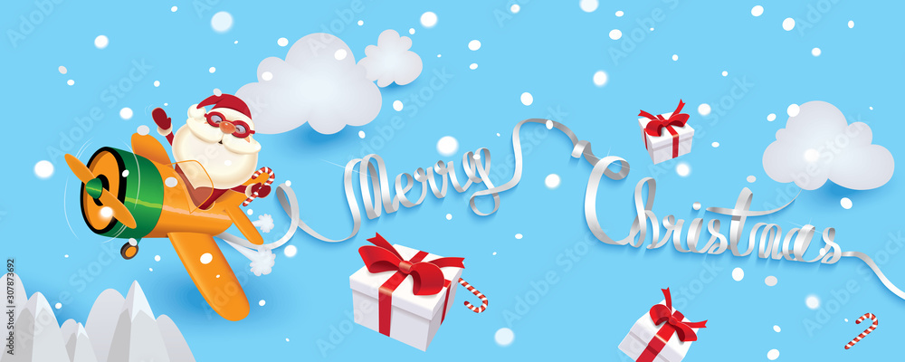 Santa Claus piloting an orange plane with red decorative paper text of ribbon Merry Christmas and shares Christmas gifts and lollipops Santa Claus piloting an orange plane with red decorative paper text of ribbon Merry Christmas and shares Christmas gifts and lollipops