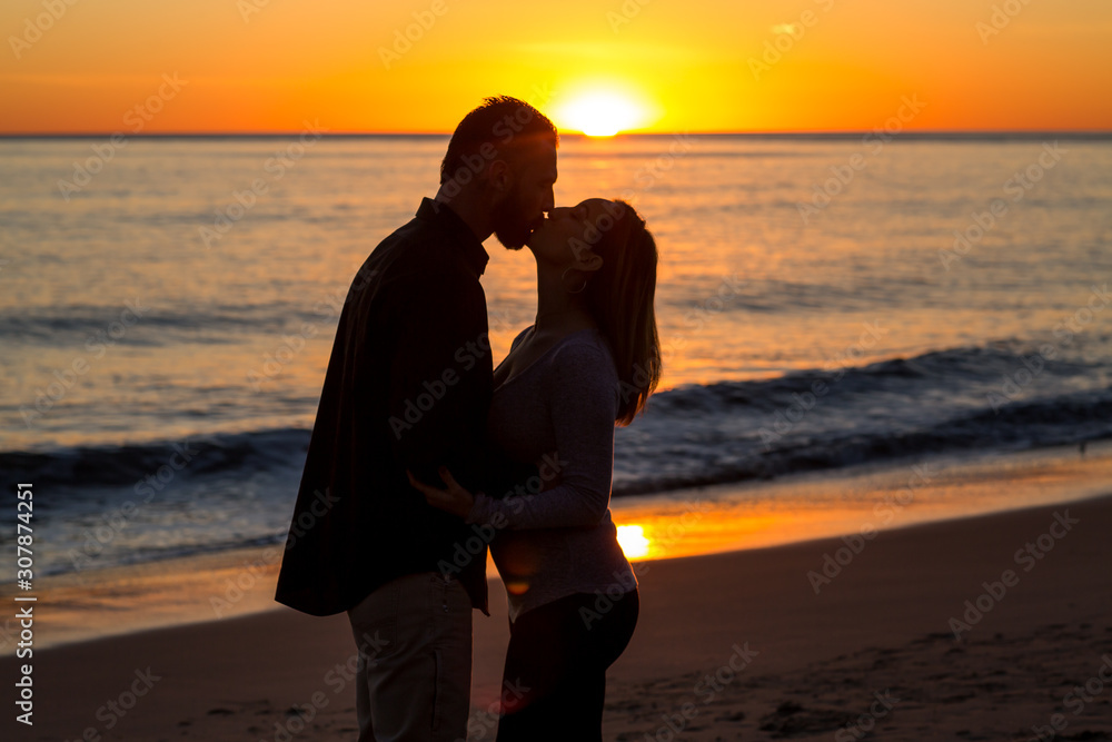Couple in Love kissing at Sunset in Malibu, Los Angeles