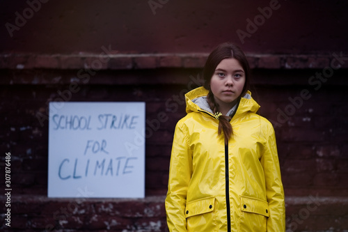 Teenager girl protesting climate change. Fridays for future photo