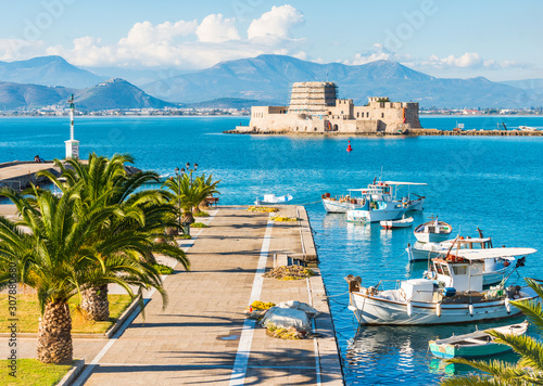 Nafplio city sea promenade and Bourtzi fortress on small island in Greece photo