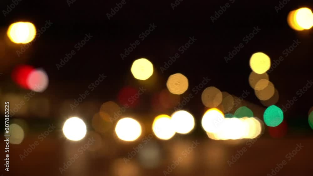 Defocused pan shot of a busy intersection in Berlin at night Defocused pan shot of a busy intersection in Berlin at night