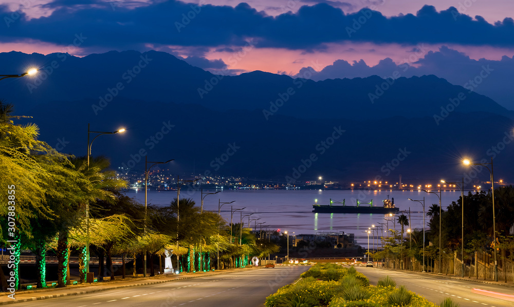 Night street leading to the Red Sea in Eilat - southernmost Israeli tourist resort city