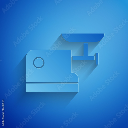 Paper cut Kitchen meat grinder icon isolated on blue background. Paper art style. Vector Illustration