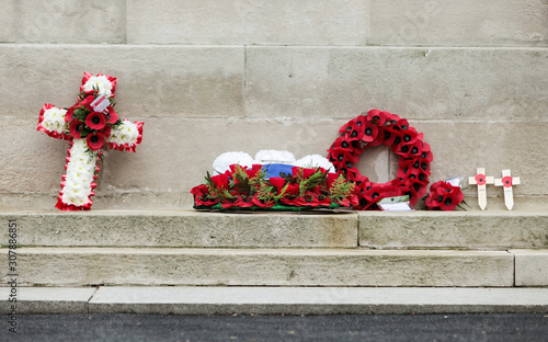 Remembrance Day: Cenotaph wreaths. Full frame detail of wreaths and messages of remembrance in tribute to those lost their lives in the line of duty.