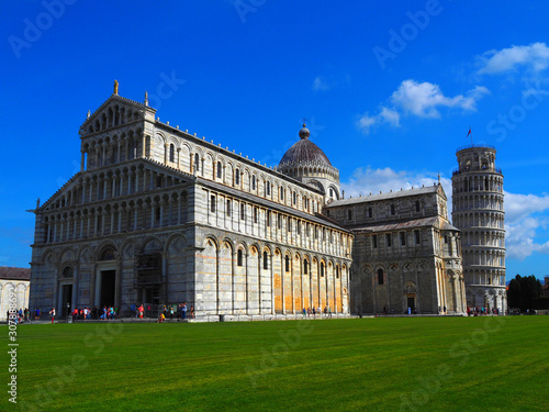 View of the Pisa Cathedral (Duomo di Pisa) and the Leaning Tower of Pisa (Torre pendente di Pisa) in Pisa, Italy. They are located in Miracoli Square (Piazza dei Miracoli). © miff32