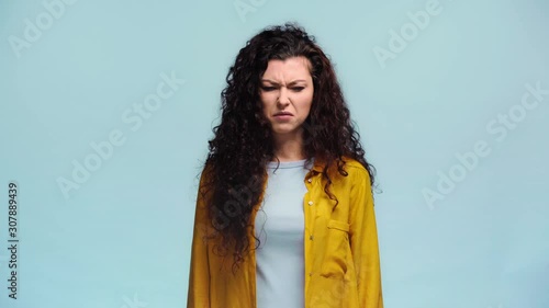woman holding smelly socks isolated on blue photo