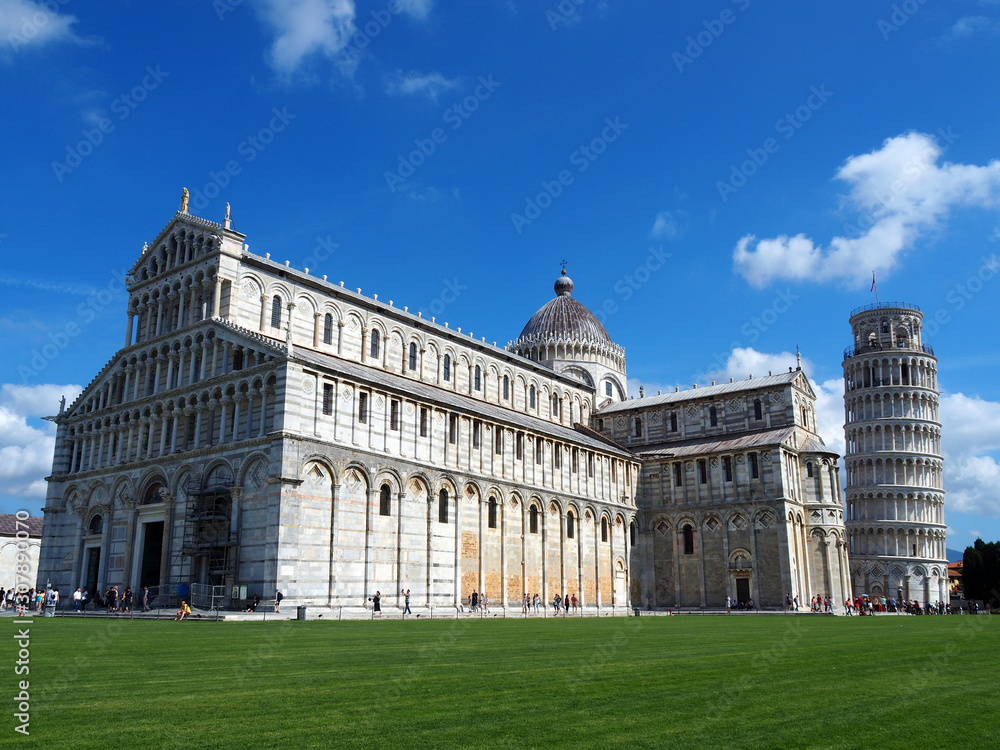 View of the Pisa Cathedral (Duomo di Pisa) and the Leaning Tower of Pisa (Torre pendente di Pisa) in Pisa, Italy. They are located in Miracoli Square (Piazza dei Miracoli).