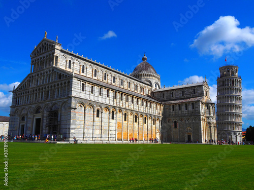 View of the Pisa Cathedral (Duomo di Pisa) and the Leaning Tower of Pisa (Torre pendente di Pisa) in Pisa, Italy. They are located in Miracoli Square (Piazza dei Miracoli).