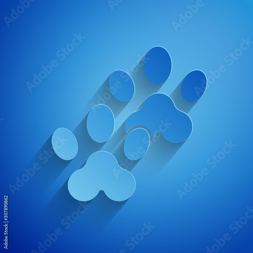 Paper cut Paw print icon isolated on blue background. Dog or cat paw print. Animal track. Paper art style. Vector Illustration